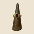 Hessonite ring on stand